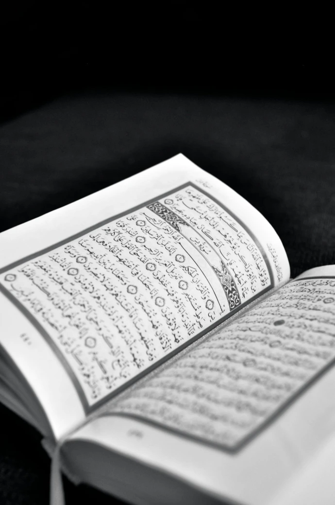 white book page on black textile